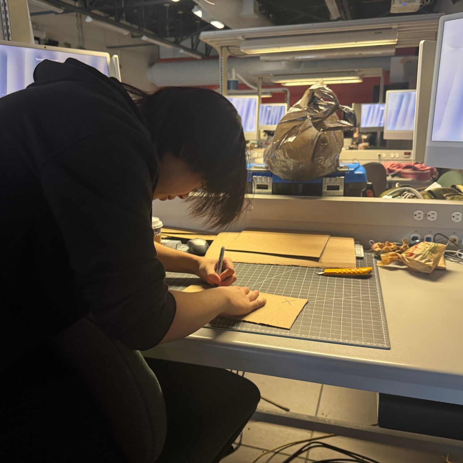 This is another view of us working on our cardboard prototype